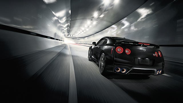 2023 Nissan GT-R seen from behind driving through a tunnel | Bob Allen Nissan in Danville KY