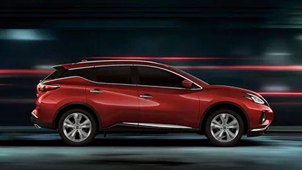 2023 Nissan Murano shown in profile driving down a street at night illustrating performance. | Bob Allen Nissan in Danville KY